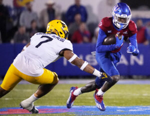 West Virginia downs Kansas to become bowl-eligible
